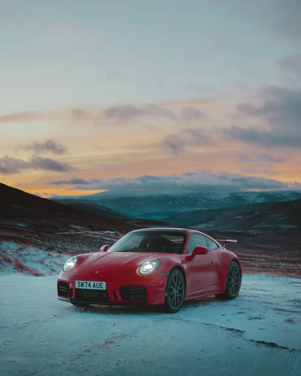 Luke’s photograph of a red Porsche in a snowy landscape